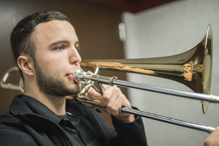 Noah Carter, Kountze freshman, plays his bass trombone before class, Monday, in the Jimmy Simmons Music Building. Carter will play in the Wind Ensemble in preparation for the Music Collage Fundraiser set for Tuesday. UP photo by Noah Dawlearn